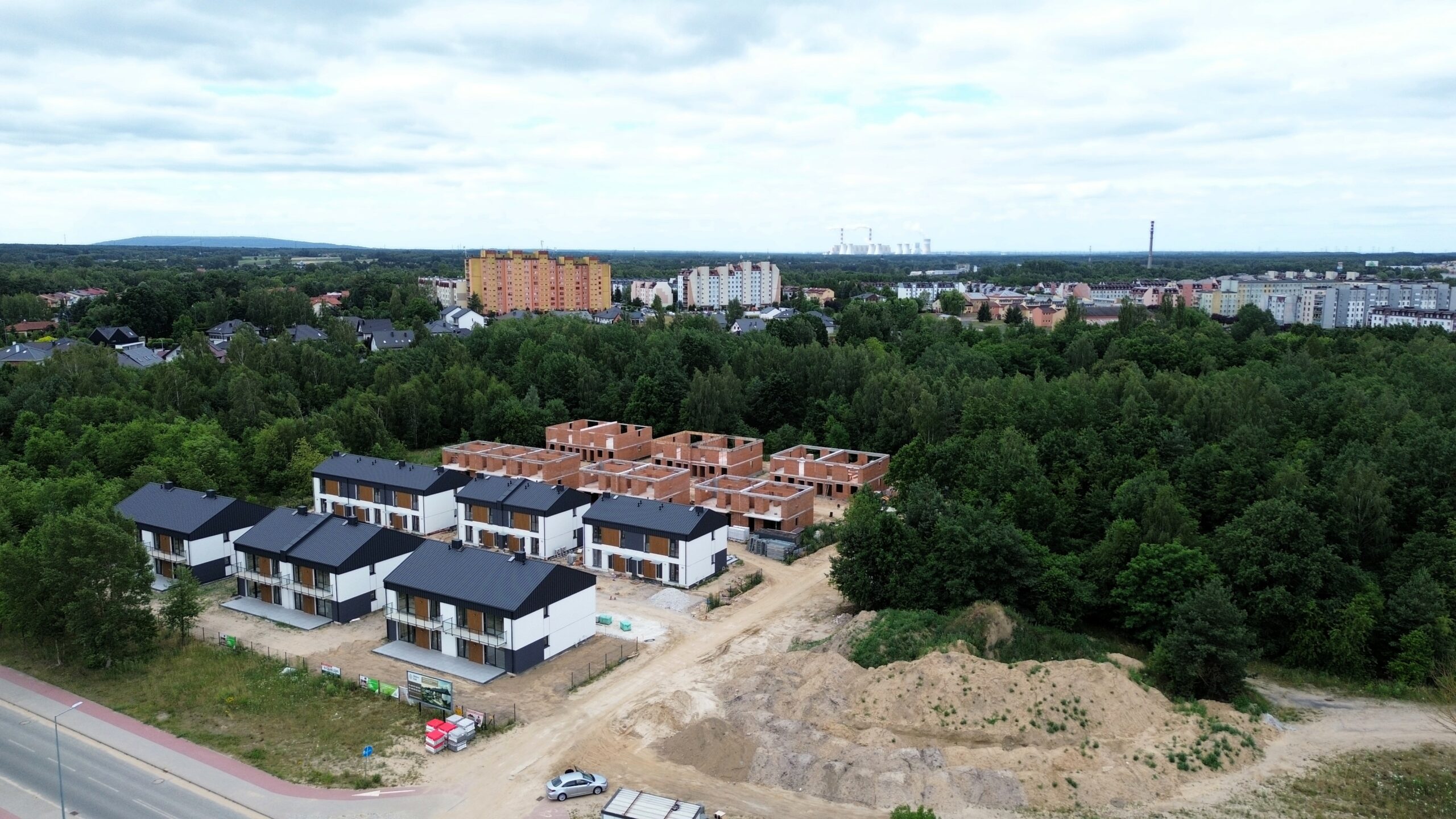 Apartament V1 - Binków park Osiedle mieszkaniowe w Bełchatowie z elektrownią w tle